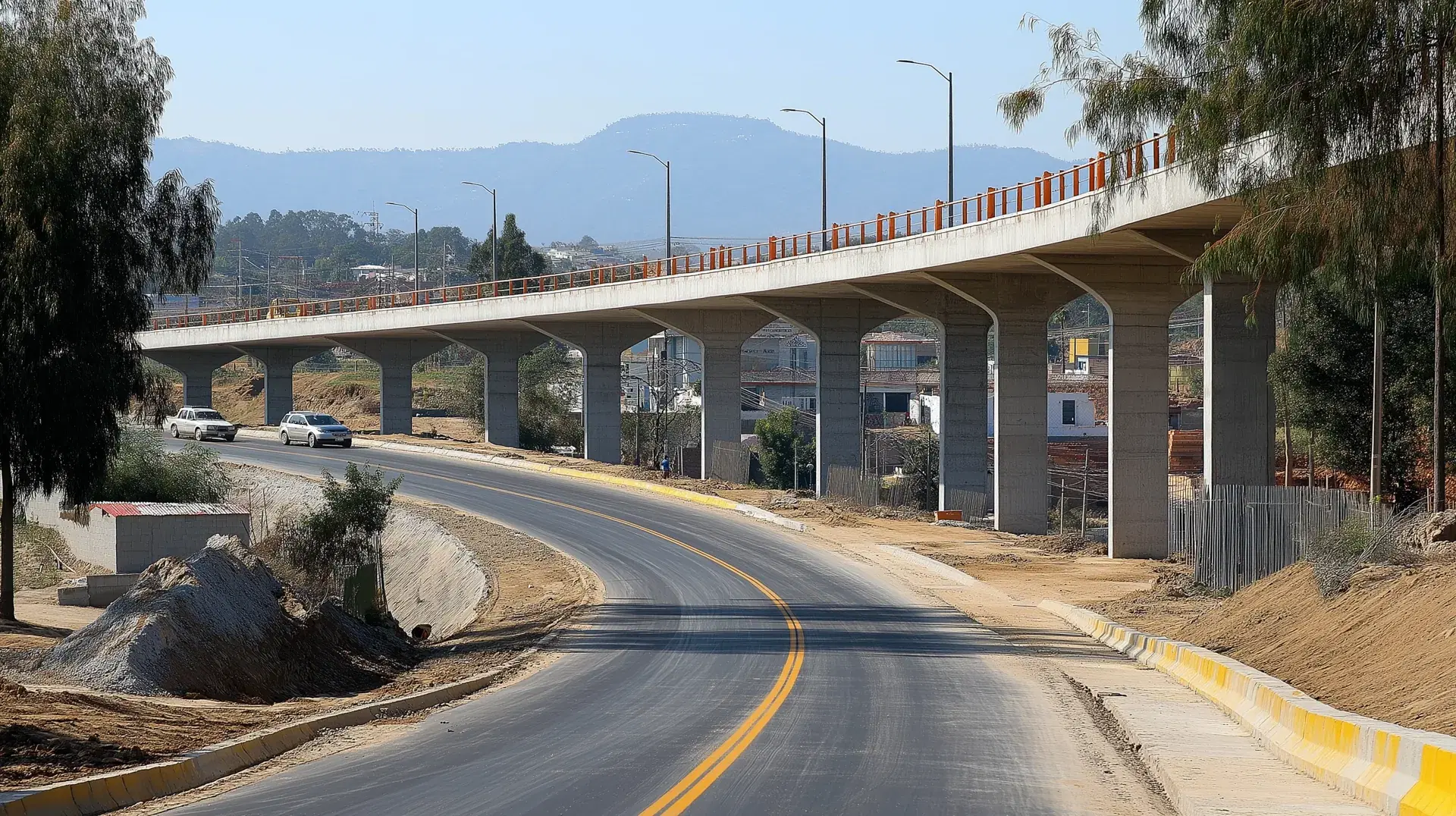 Viaducto elevado terminado sobre columnas de concreto, con parapeto metálico y luminarias, corriendo paralelo a la vialidad inferior recién pavimentada y señalizada.